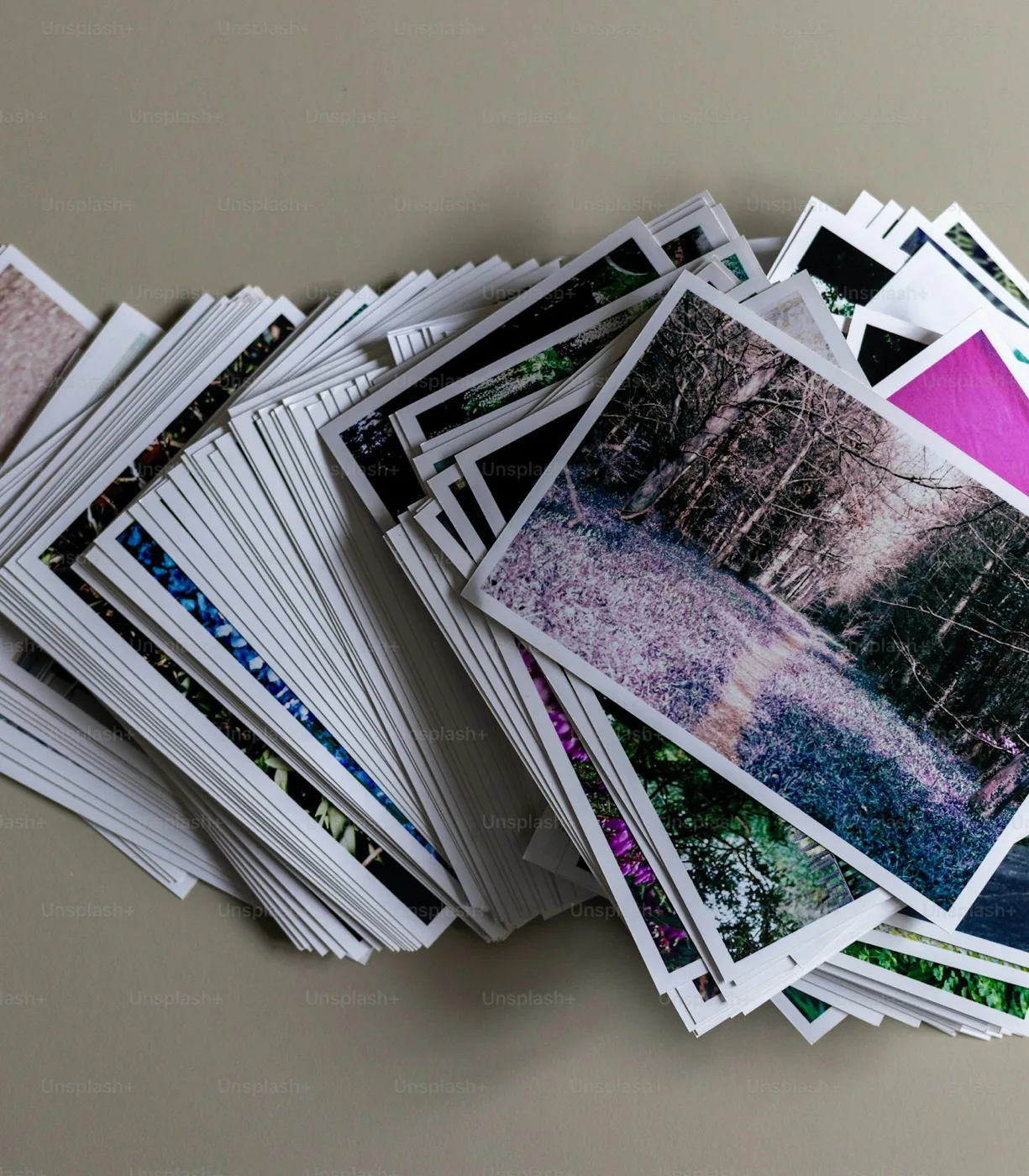A stack of printed family photographs